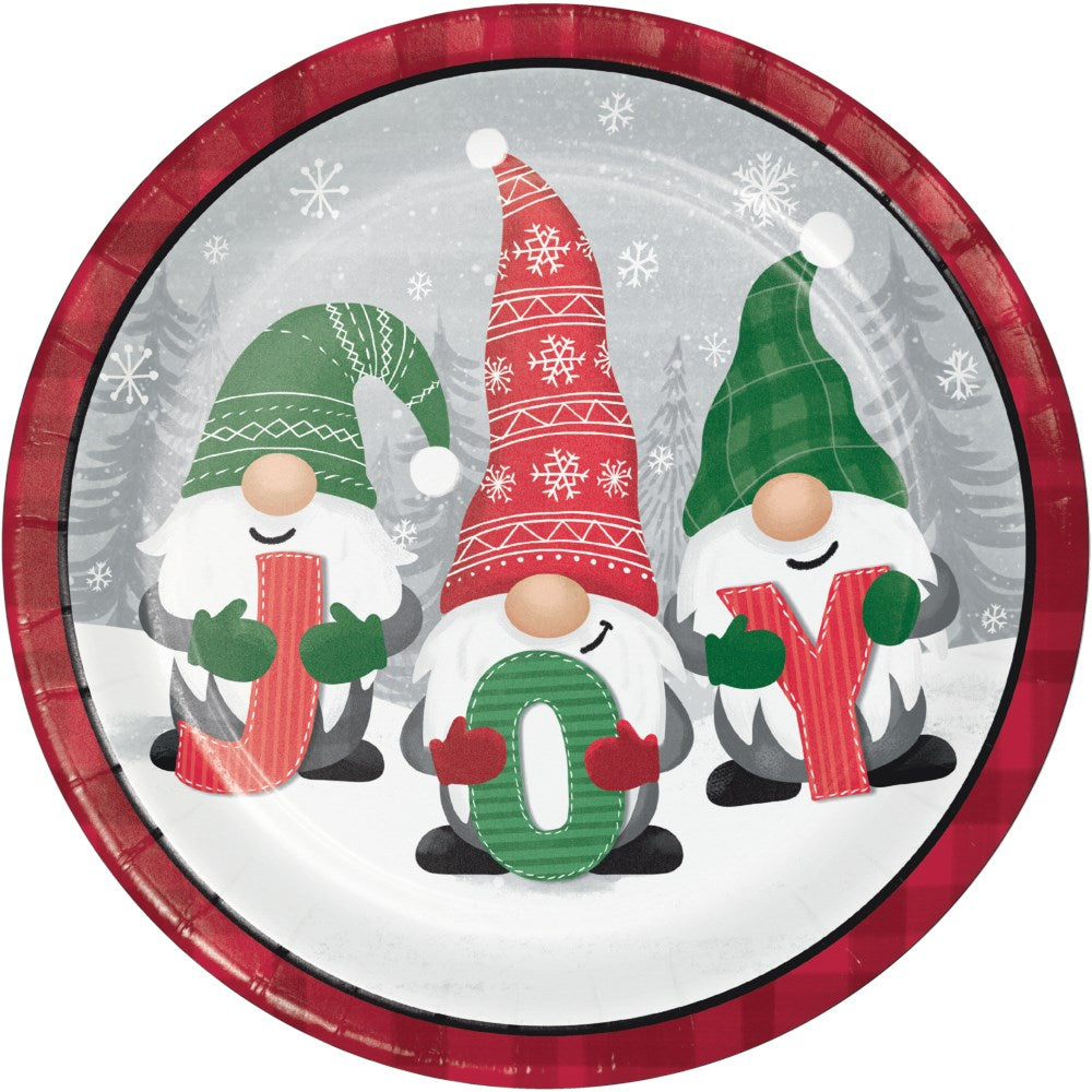 Round dinner plate with red plaid rim featuring three festive gnomes in green and red hats holding letters spelling "JOY".