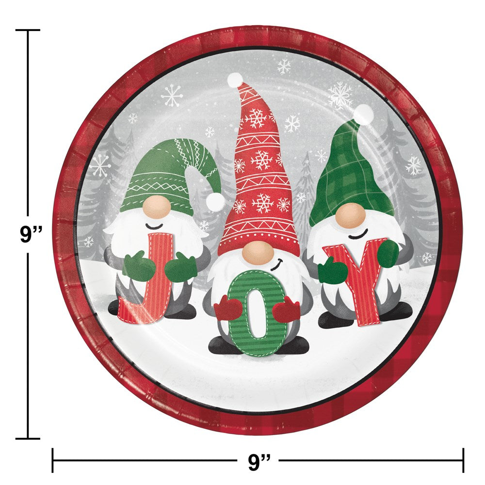 Round ceramic dinner plate with red rim featuring three holiday gnomes holding candy cane letters J, O, Y on snowy.