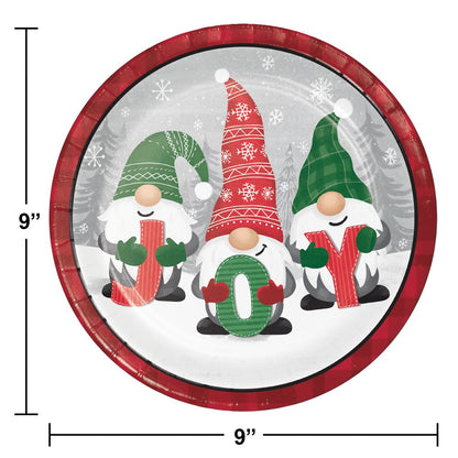 Round ceramic dinner plate with red rim featuring three holiday gnomes holding candy cane letters J, O, Y on snowy.