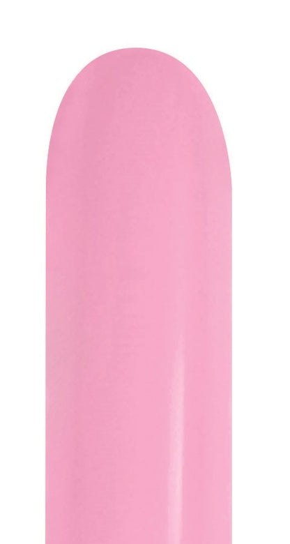 Long, slender bubble gum pink latex balloon uninflated with smooth surface.